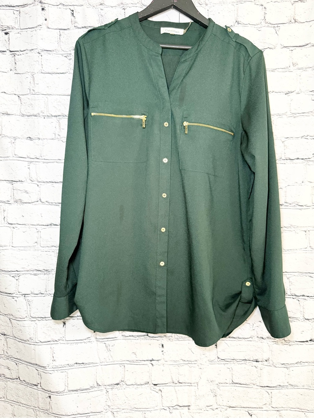 Calvin Klein. Green blouse with gold accents. Size 8